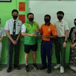 OLA President Cason Ong with teachers and students who received the masks